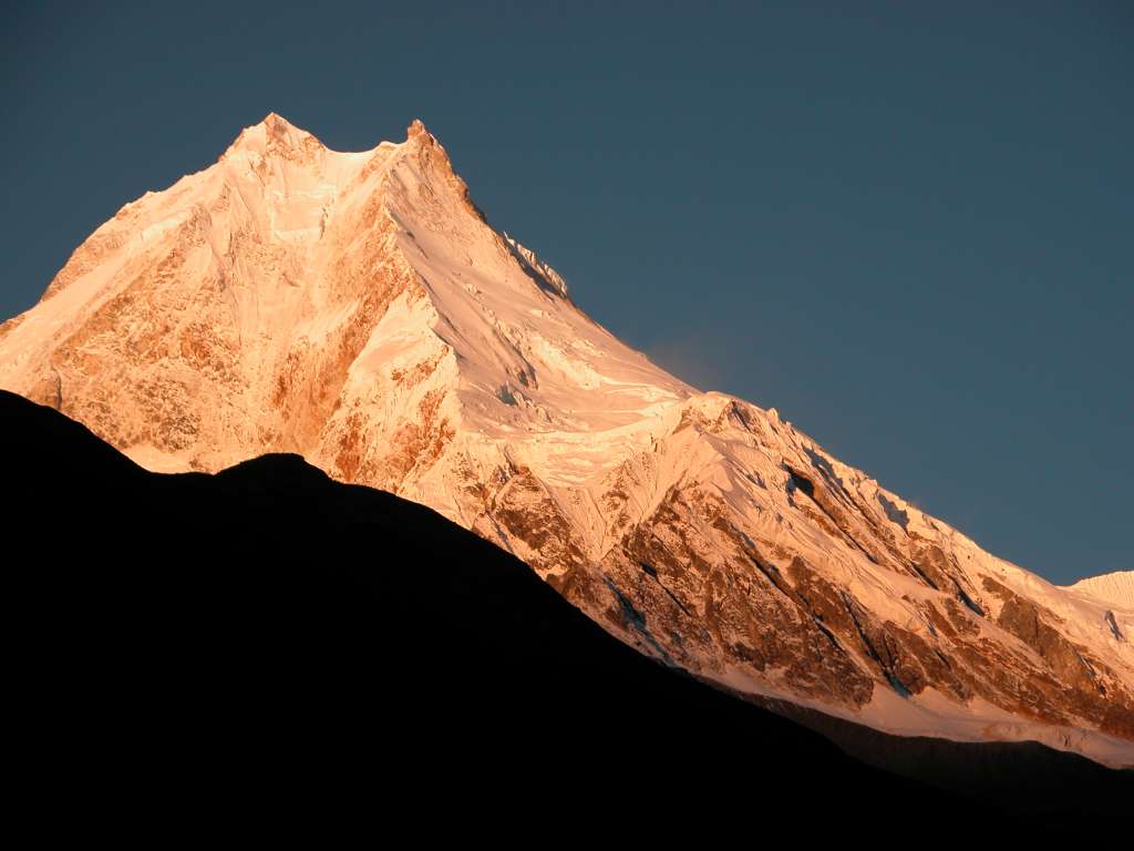 Manaslu 07 03 Manaslu Medium Shot Sunrise From Syala Wow! The subtle changes of the light on Manaslu are terrific. Manaslu (8156m) is said to derive from the Sanskrit word Manasa, which means soul; therefore Manaslu is the Mountain of the Soul. It was earlier known as Kutang I, while the Survey of Indias symbol was merely Peak XXX. According to Snelgrove, the local Tibetan name for Manaslu is Pung-gyen, which is also the name to the god who resides on it.